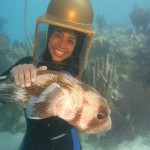 Helmet diver in Bermuda holding ET the porcupine puffer.