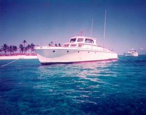 65 ft huckins yacht at Rose Island in the Bahamas